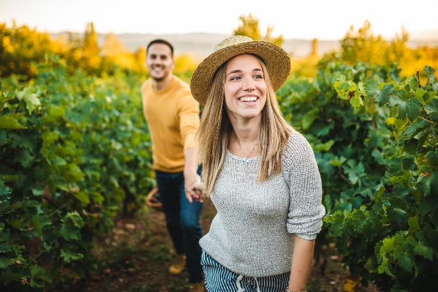 Couple walk through the Rathfinny Estate vineyard