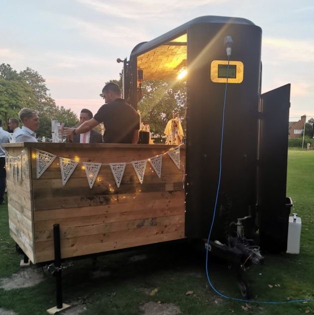 Rustic Mobile Bars' converted horsebox serves wedding drinks