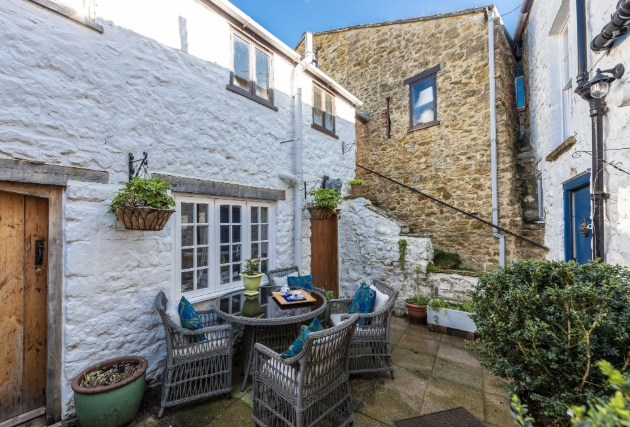 Courtyard shot of cottage and dining 