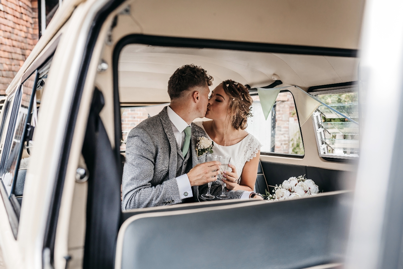 Couple in wedding car