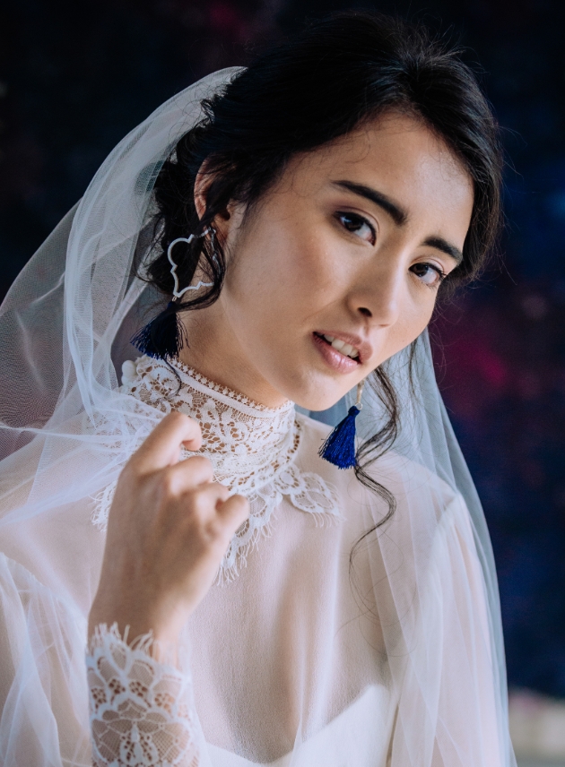 Bride with dress on and veil