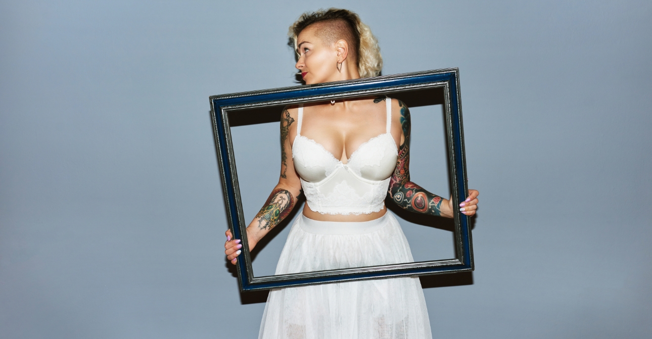 funky alternative bride with tattoos and undercut wearing two piece bridal attire