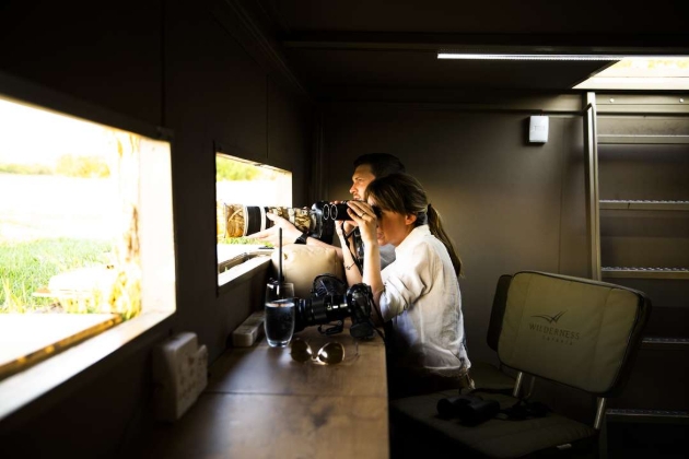 Man and woman in a bird hide