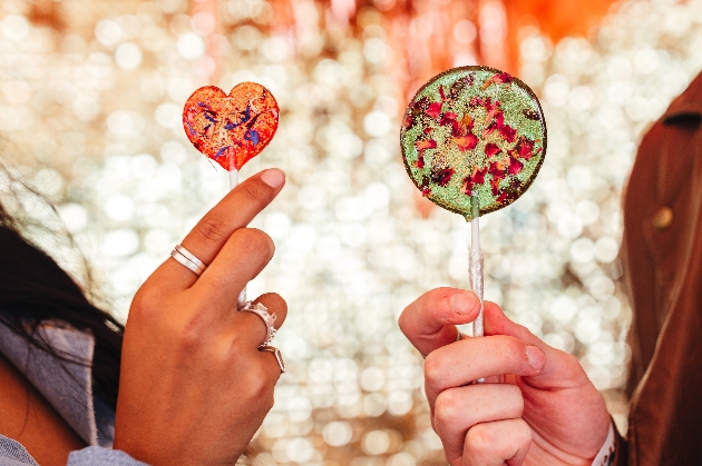 wedding lollipops with flower petals captured inside.