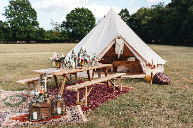 Bell tent with grazing table set up outside