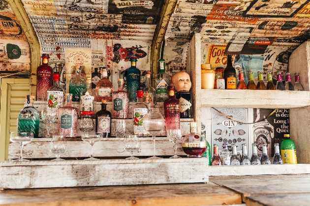 Interior of mobile gin bar with lots of varieties displayed