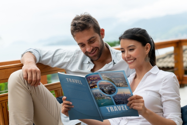 couple looking at travel mag