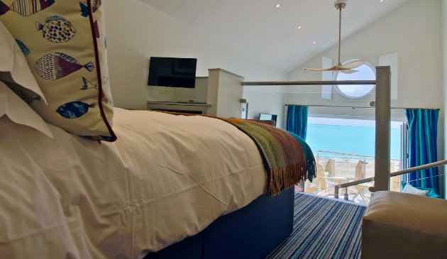 Beach hut bedroom mezzanine with view