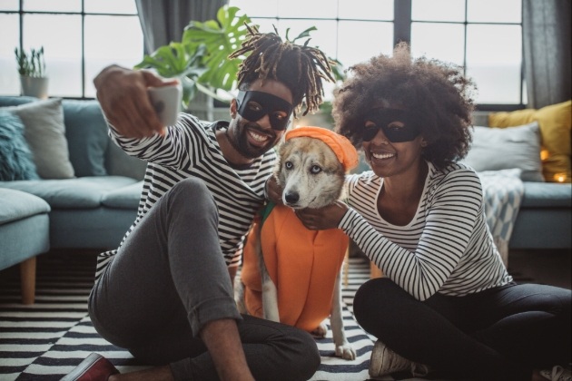 couples dressing up with their pet dog