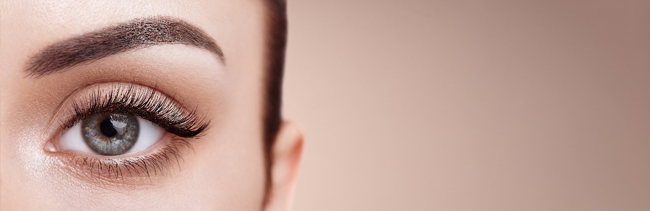 close up of woman's eye with beautiful eyelashes and perfect brow