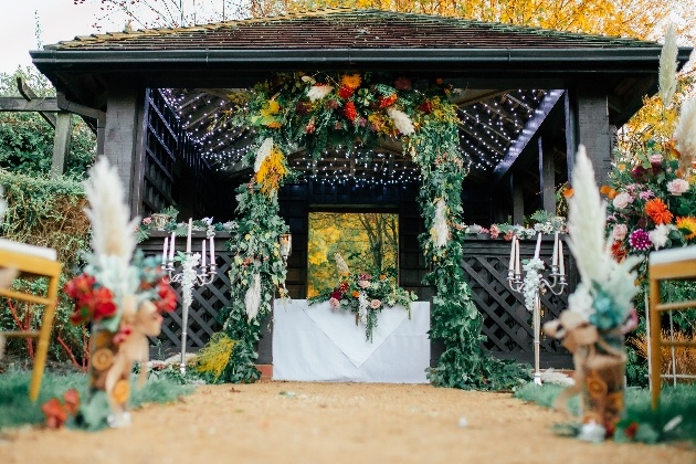 Wedding ceremony gazebo at Tilgate Park set up for styled shoot with autumnal hues