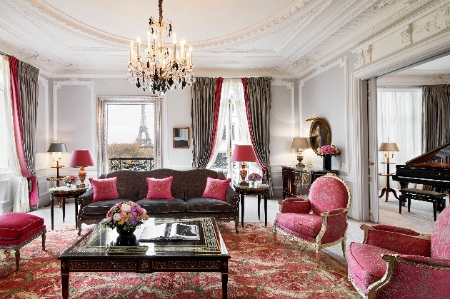 hotel room pink and gold baby grand piano in room