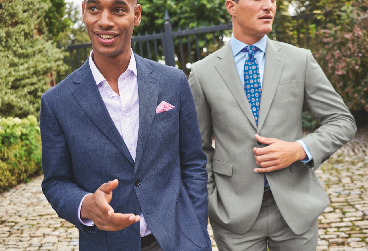 two male models in men's suit one blue one grey 