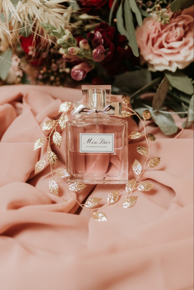 Miss dior perfume with gold toned bridal hair vine and bouquet