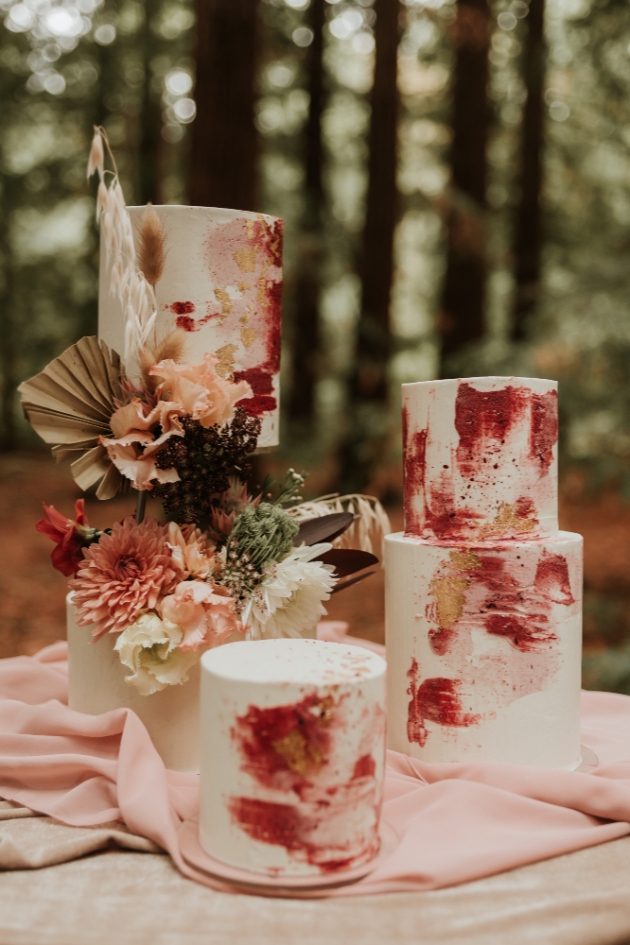 wedding cakes decorated in burgundy and gold