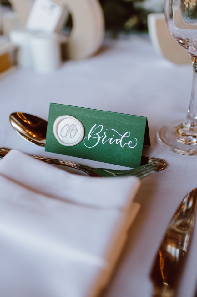 Emerald green place cards with wax seal