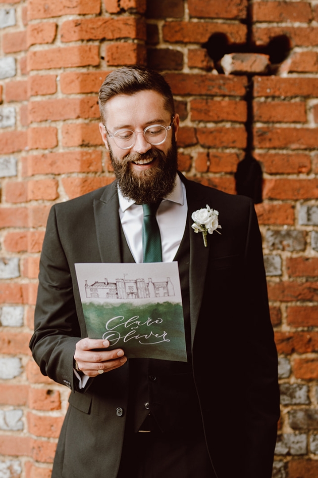 groomsmen holding a reading