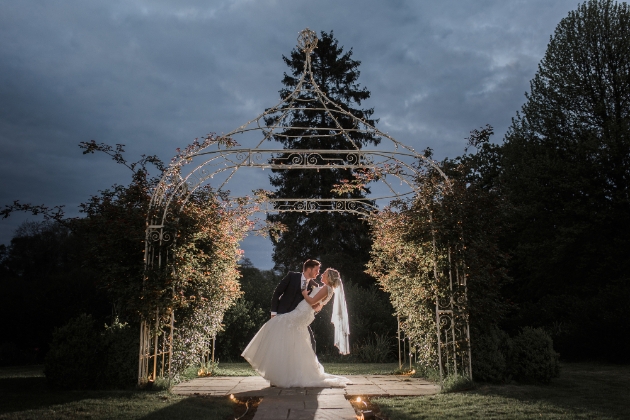 Bride and groom at dusk Southdowns Manor grounds