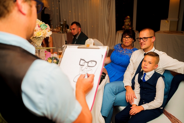Caricaturist sketching a family portrait