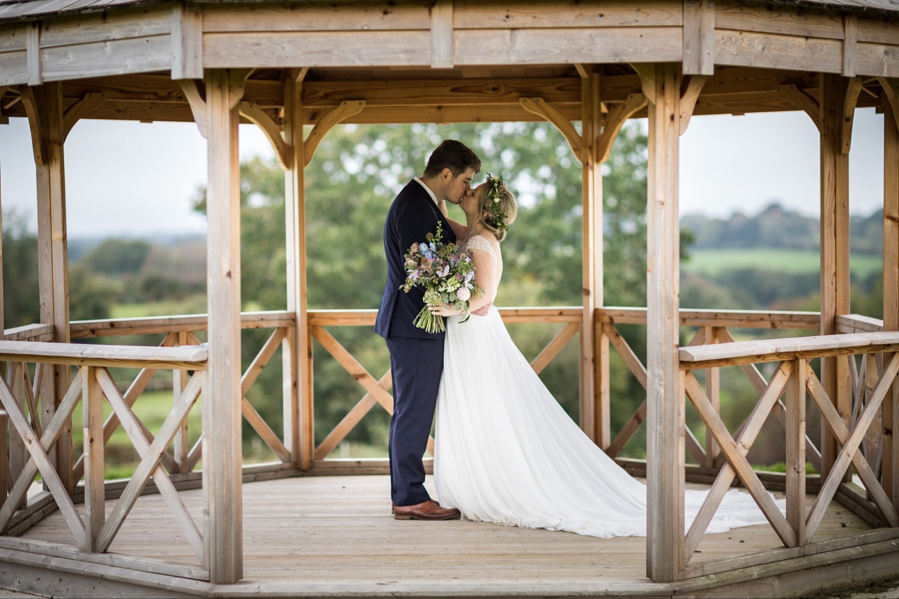 Couple kiss in pavilion