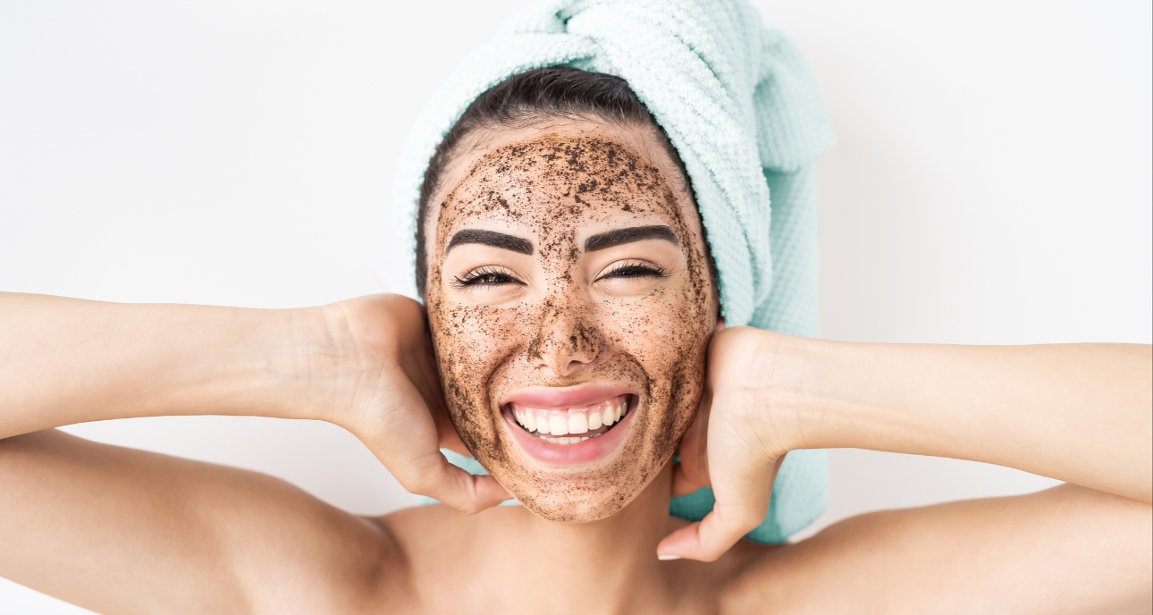 Woman exfoliating her face