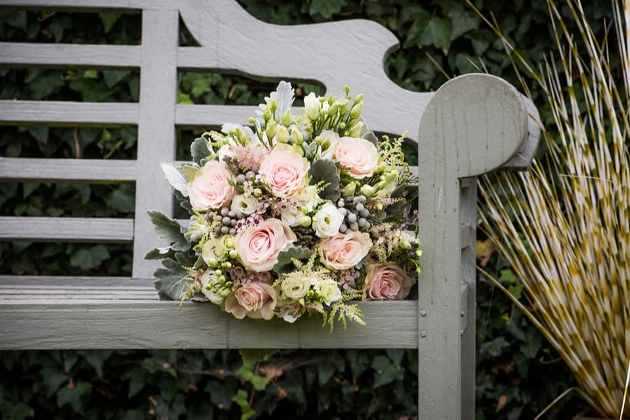 bouquet laying on a bench