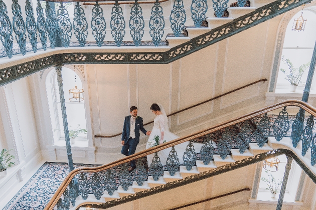 Couple walking down a staircase in The Grand Brighton