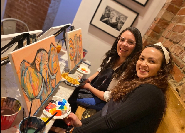 Two girls painting