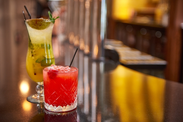 two cocktails on a bar