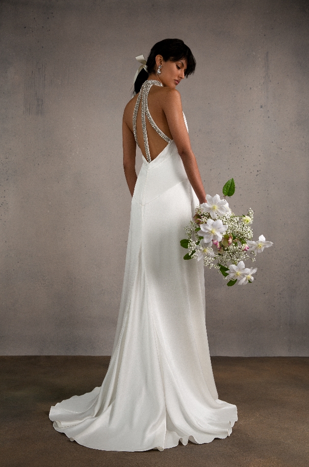 silk  like gown flowing with thick diamante straps on back