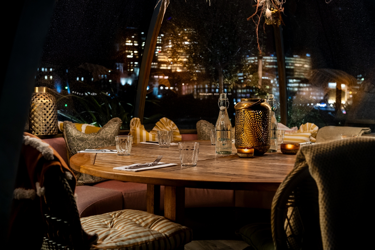 cosy blankets on chairs wooden table inside igloo