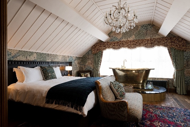 cosy room with a white wood ceiling and flock wall paper