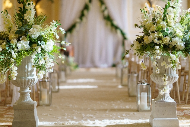 Flowers lining the aisle at The Grand Hotel