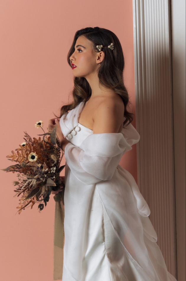 Hollywood glam bride against pink wall background