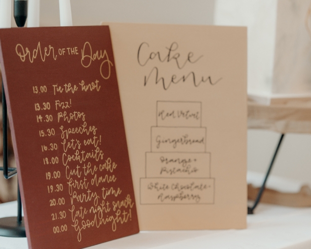 wedding order of the day and cake menu calligraphy signs