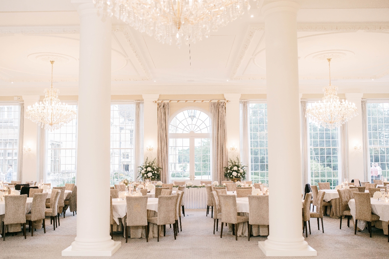 interior wedding room all white chandeliers and pillars