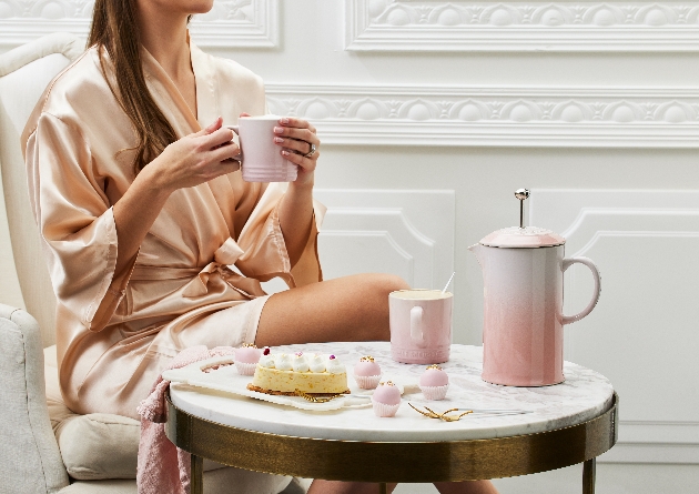 woman sat at chair with morning breakfast crockery collection