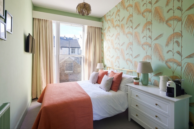 beautiful peaceful bedroom at landsdowne house decorated in sage green