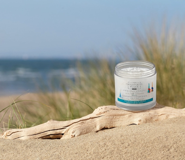 White container on sand dune. 