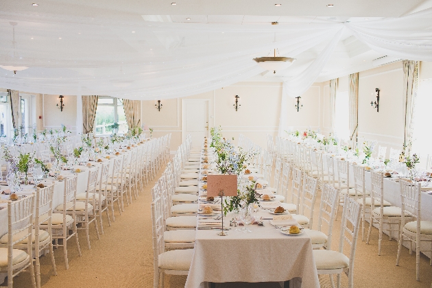 Interior of Deans Place function room set up for a wedding ceiling drapes