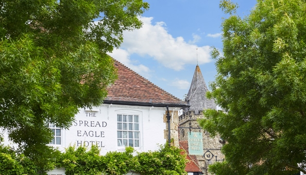 spread eagle hotel and spa with church spire in the background