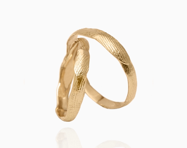 gold bands with fingerprint detail