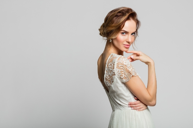 Bride with beautiful skin looking over her shoulder