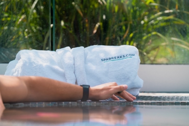 towel robe by side of pool