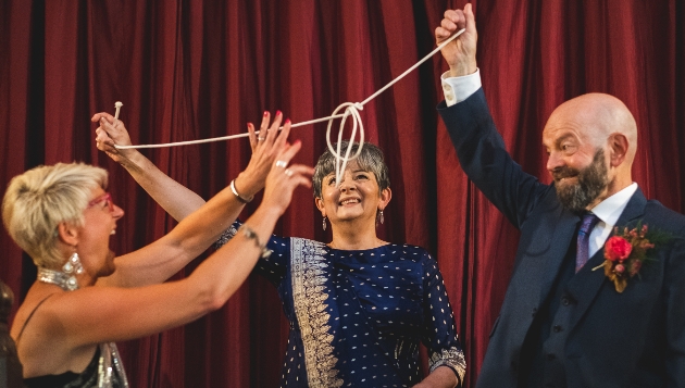 Kate and Kate Celebrants taking part in magic trick with wedding magician