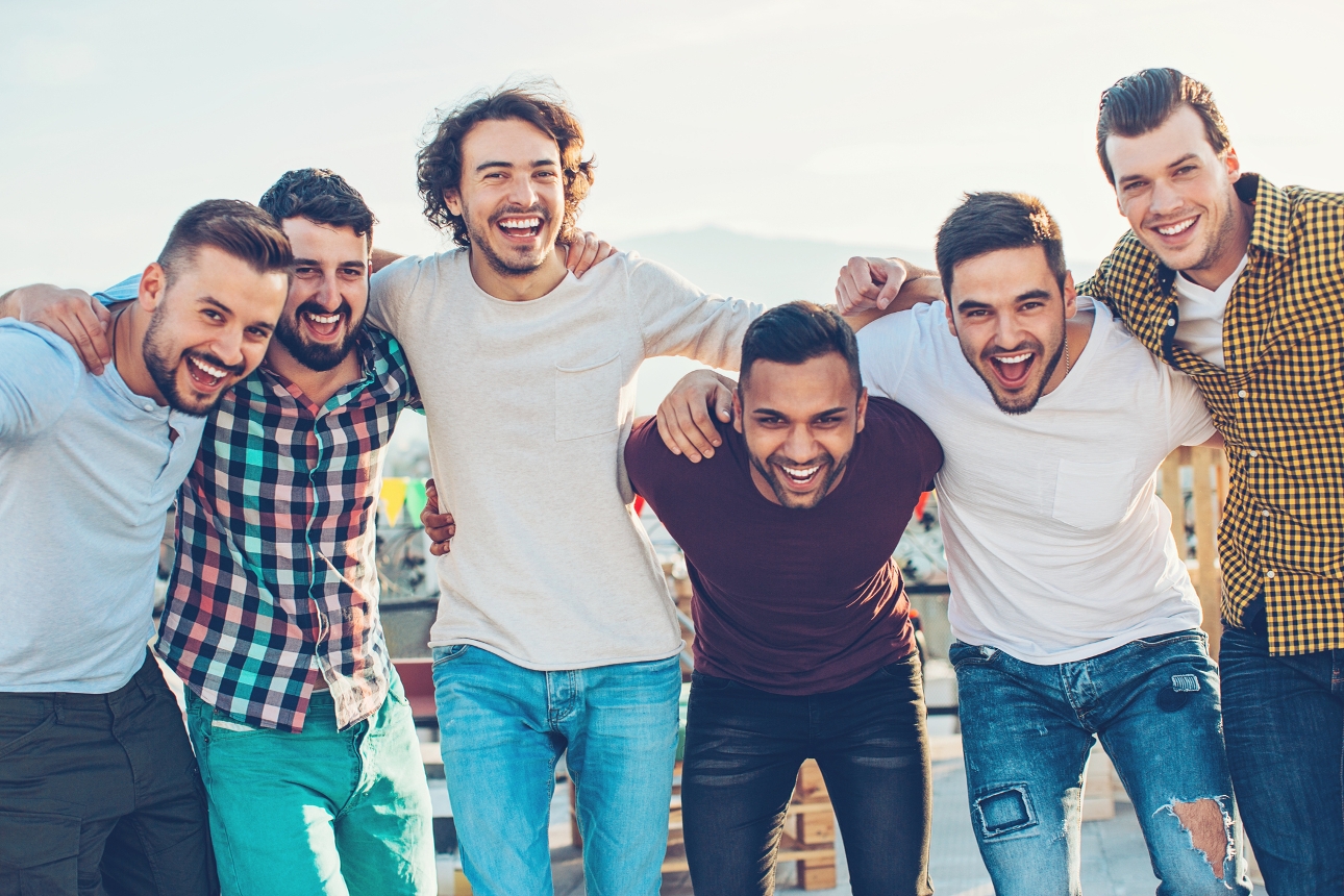 group of men on holiday standing in a row