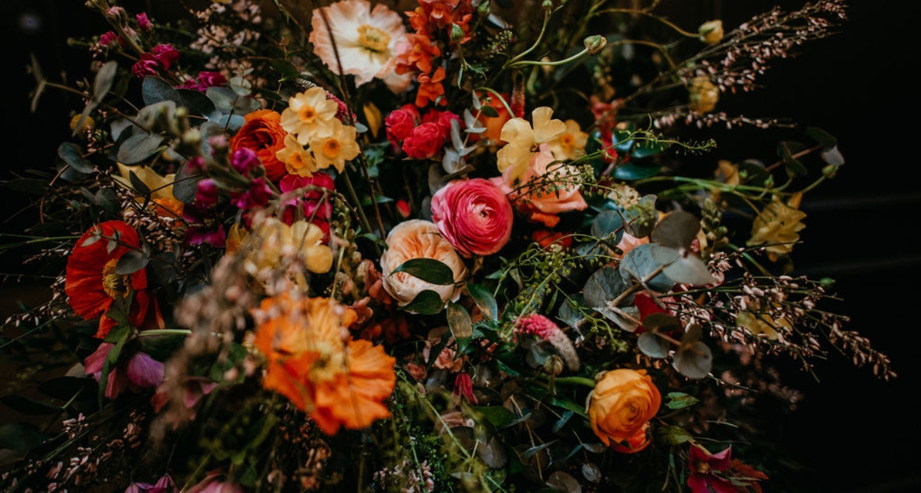 stunning autumnal toned floral spray bouquet