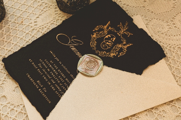 black and gold wedding stationery