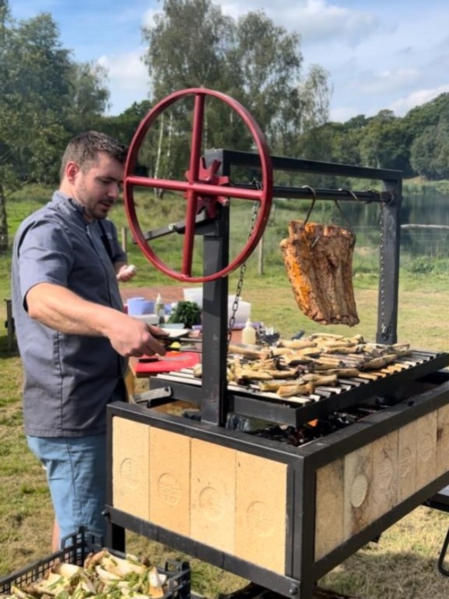 man barbecuing meat