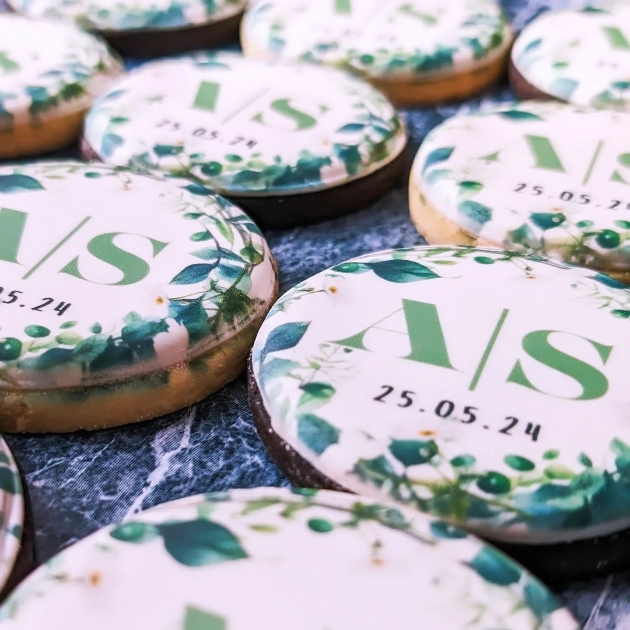 Personalised wedding cookies with green foliage and AS monogram